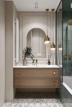 a bathroom with a sink, mirror and bathtub next to a walk in shower