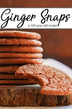 a stack of ginger snaps on top of a white plate next to a pile of cookies