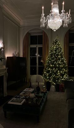 a living room filled with furniture and a christmas tree