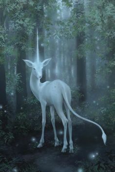 a white unicorn standing in the middle of a forest