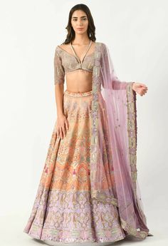 The husnsah lehenga set is a bright and beautiful attire in lavender and peach. The lehenga is vivid with geometric & floral embroidery and multicolored sequin mixed with mirrorwork while the blouse features intricate details and an off shoulder v neckline.The lehenga is a perfect festive wear that brings glamour even with minimal accessories and makeup. Designer Peach Lehenga With Intricate Embroidery, Orange Anarkali Lehenga With Mirror Work, Anarkali Style Orange Lehenga With Mirror Work, Designer Orange Lehenga With Mirror Work, Designer Wear Peach Lehenga, Peach Choli With Sheer Dupatta For Reception, Designer Wear Orange Lehenga With Mirror Work, Peach Lehenga With Intricate Embroidery For Reception, Designer Anarkali Lehenga In Peach