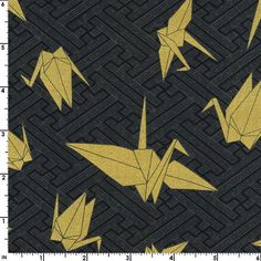 a black and gold fabric with origami birds on it