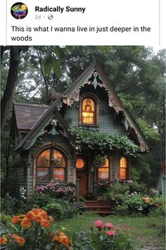 an image of a small house with flowers in the front yard and trees around it