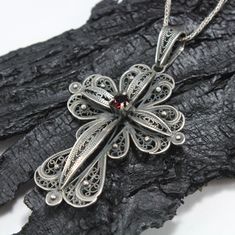 Sterling Silver Garnet Antiqued Filigree Cross Pendant - Silver Cross Pendant, Handmade Cross Necklace, Filigree Cross, Armenian Silver A silver cross is always a thoughtful gift! Made of solid sterling silver 925. An engraved design makes this cross unique. Beautiful worn alone, amazing combined with other necklaces! PRODUCT DETAILS The cross is 55*40 mm Weight 8.5 gr. A black cord will be sent with the pendant. There is no clasp on the necklace. It can be worn over the head. All items are made Ornate Handmade Cross Jewelry, Handmade Cross Pendant Jewelry For Wedding, Traditional Handmade Cross Necklace, Handmade Cross Pendant Necklace For Weddings, Traditional Handmade Cross Jewelry, Armenian Cross, Lace Ideas, Pomegranate Necklace, Antique Filigree