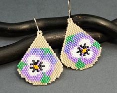 the beaded earrings are decorated with flowers