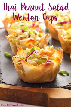 there are many small pastry cups on the tray with text overlay that reads, thai peanut salad wonton cups