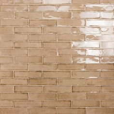 a brown brick wall with white tiles on it