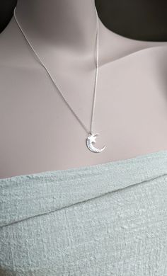 Sterling Silver hammered crescent moon and shiny star necklace. The moon is Hand-forged hammered and polished and finally a little polished star added to this cute necklace.  All elements are 925 recycled sterling silver. This comes on a 925 sterling silver trace chain. Moon measures  2 cm, Star 8 mm. Small Moon and Star necklace 1.5cm.  https://www.etsy.com/uk/listing/1312368828/moon-and-star-necklace-hammered-moon Hammered double star necklace https://www.etsy.com/uk/listing/483228606/hammered Sterling Silver Moon Charm Jewelry Gift For Her, Hammered Crescent Jewelry, Hammered Half Moon Jewelry As A Gift, Hammered Half Moon Jewelry For Gifts, Hammered Half Moon Jewelry For Gift, Hammered Crescent Jewelry Gift, Elegant Silver Hammered Charm Necklaces, Elegant Sterling Silver Crescent Charm Necklace, Elegant Silver Hammered Charm Necklace