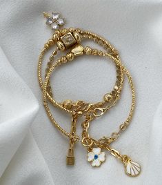 This stunning 3-piece bracelet set, featuring a gold plated glitter clover charm and Dorica balls, combines elegance with a touch of luck. Perfect for layering or wearing individually, this bracelet combination adds a chic and sophisticated style to any outfit. 🍀✨ Set of 3 bracelets featuring glittery clover charms for a lucky vibe Gold plated Dorica balls for added shine and luxury Versatile design that can be worn together or separately for different looks Hypoallergenic, nickel-free materials, perfect for sensitive skin Adjustable size for a comfortable and secure fit Ideal for daily wear or special occasions, adding a refined touch Makes a great gift for loved ones or a stylish accessory for yourself Bracelets Design, Clover Charm, Style Chic, Elegant Jewelry, Outfit Set, Sophisticated Style, Stylish Accessories, Bracelet Designs, Bracelet Set