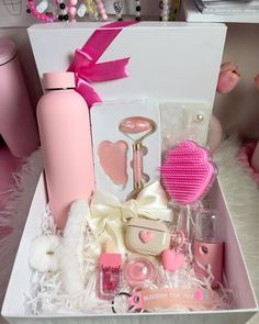 a pink box filled with lots of different items