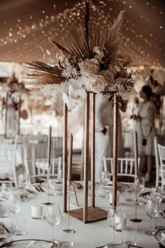 the centerpieces are decorated with flowers and candles