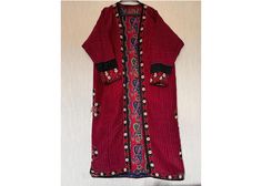 Add a unique and exotic touch to your wardrobe with this antique Turkmen silk kaftan, also known as a kimono or chapan. This original piece from the 1960s is a great addition to any collection. It is made from hand-woven silk and cotton fabrics used as lining. All embroidery is in silk. Used. Showcasing vibrant and colorful Turkmen regional design. The multicolored silk material adds a luxurious touch to the piece. Perfect for cultural events, this Turkmen traditional garment is a must-have for Bohemian Ceremonial Kaftan With Dabka, Bohemian Ceremonial Kaftan With Dabka Detailing, Bohemian Dabka Kaftan For Ceremonial Occasions, Red Bohemian Kaftan With Floral Embroidery, Traditional Silk Abaya, Red Folk Style Long Sleeve Kaftan, Red Ceremonial Kaftan For Eid, Traditional Silk Abaya For Eid, Folk Style Kaftan With Intricate Embroidery For Traditional Ceremonies