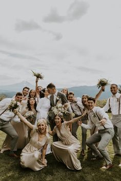 a group of people standing next to each other on top of a lush green field