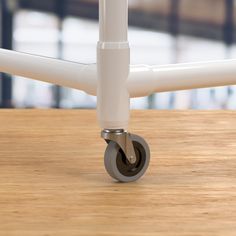 a close up of a metal object on a wooden table