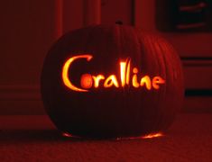 a carved pumpkin with the word crolline on it's face lit up