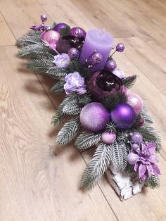 purple and silver christmas decorations on the floor