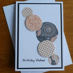 a birthday card with circles and polka dots on the front that says, happy birthday wishes