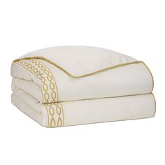 three white sheets with gold trims on them