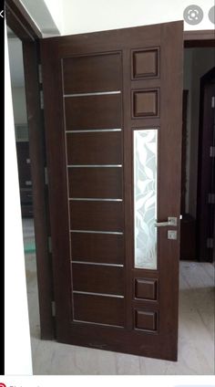 the door is made of wood and has frosted glass panels on each paneling