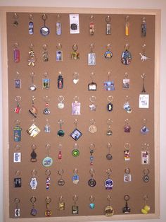 a bulletin board covered in lots of different items on it's sides and hanging from the wall