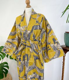 Express Urgent Upgrade at Checkout only for Domestic Uk Pre Christmas Deliveries applicable for Mainland only until Friday 12 Noon .The magic of Block prints using wooden blocks and natural dyes in small villages of Rajasthan, flowing into House Robes/Kimonos. Pure Cotton Kimono with Hand Block printing .  Pure cotton is most gentle on skin and also an easy care . Gorgeous Colours with Azo free dyes for a delicate look inside and outside your home.  Twin Pockets  . Soft Solid Cotton piping detail  Size : Free size : UK 10 upto Size UK 16/18 Length : 50  inch approx Style it well with your night dress when home. Relaxed look to team it up with a pair of denims/shorts and tee.  Great for New Mums for comfort clothing. Makes great beach cover up. Funky House, Kimono Floral, Belted Robe, Summer Wraps, Summer Kimono, Sleepwear Dress, Printed Robe, Indian Block Print, Cotton Kimono