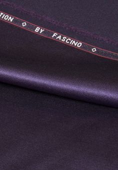 the back of a purple shirt with red stitching on it and an inscription that says fashion by fascino