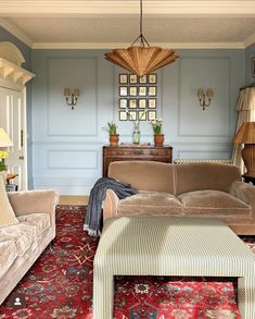 a living room with blue walls and furniture