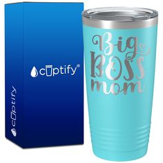 a blue cup with the words big boss mom printed on it next to a box