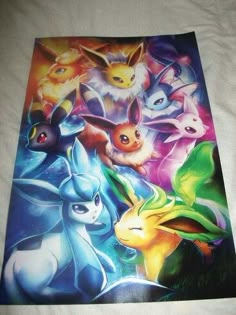 the pokemon poster is laying on top of a white bed sheet with an image of several different types of animals