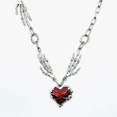 Embrace your edgy side with our Skeleton Hand Heart Necklace, featuring intricate silver-plated metalwork and a striking red enamel pendant that perfectly captures the essence of gothic punk style. This unique piece makes a thoughtful gift for her, ideal for Halloween or as a bold statement accessory for everyday wear--add it to your collection today and let your individuality shine!Skeleton Hand Heart Necklace, Silver Plated Metalwork Red Enamel Pendant, Gotic, Punk, Halloween, Grunge, Y2k, Gif Punk Red Necklace For Halloween, Silver Grunge Jewelry For Valentine's Day, Grunge Metal Necklaces For Valentine's Day, Edgy Heart-shaped Halloween Necklace, Grunge Heart-shaped Metal Necklace, Grunge Heart-shaped Jewelry For Halloween, Edgy Metal Necklaces For Valentine's Day, Edgy Metal Necklace For Valentine's Day, Punk Silver Jewelry For Valentine's Day