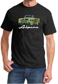 a man wearing a black t - shirt with a green car in the background that says super bee