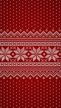 a red and white knitted pattern with hearts on the bottom, as if it were from a sweater