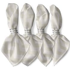 three white ties tied to each other in front of a white background with checkered pattern