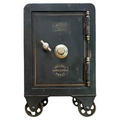 an old fashioned safe on wheels is shown