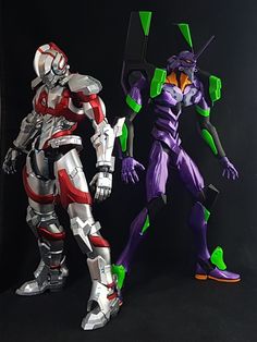 two action figures are standing next to each other