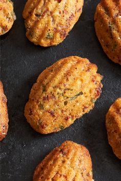 some food is laying out on a black surface and it looks like they have been cooked