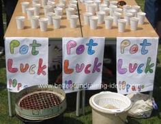 two tables that have some cups on top of them and one has a sign with the words pott luck