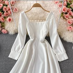 Chic White Mini Dress With Long Sleeves, White Long Sleeve Summer Party Dress, Chic White Long Sleeve Summer Dress, White Long Sleeve Solid Color Mini Dress, White Long Sleeve Mini Dress For Summer, White Knee-length Long Sleeve Party Dress, White Solid Mini Dress, White Long Sleeve Solid Color Midi Dress, Elegant White Long Sleeve Dress For Summer