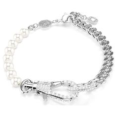 This impactful Dextera bracelet features an array of details to admire. The rhodium plated design combines a solid chain with a string of small white Swarovski Crystal Pearls, joined in the center with a distinctive lobster closure adorned with pavé clear crystals. A powerful choice for bold looks. Chic Silver Chain Bracelet For Formal Occasions, Elegant White Silver Chain Bracelet, Elegant Metal Chain Bracelet With Pearl, Elegant White Bracelet With Silver Chain, Luxury White Bracelets With Adjustable Chain, Luxury White Bracelet With Adjustable Chain, Elegant Silver Chain Bracelets, Silver Metal Pearl Bracelet With Chain, Silver Bracelet With Pearl Charm For Party