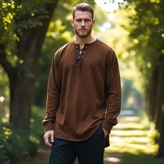 This brown long-sleeve tunic offers a perfect blend of comfort and historical style, inspired by Viking and medieval designs. The lace-up neckline and relaxed fit make it a versatile piece for Renaissance fairs, Viking reenactments, cosplay events, or casual wear. Made from soft, breathable fabric, this tunic is both durable and stylish, ideal for layering with your favorite medieval or fantasy-inspired outfits. Whether you're attending a themed event or looking to add a touch of history to your Long Sleeve Medieval Dress With Historical Design For Fall, Fall Medieval Dress With Historical Design, Fall Medieval Dress With Long Sleeves, Long Sleeve Medieval Dress With Historical Design For Festivals, Viking Style Long Sleeve Medieval Dress For Festivals, Viking Style Long Sleeve Medieval Dress For Larp, Long Sleeve Medieval Dress With Historical Design, Elvish Long Sleeve Medieval Cosplay Dress, Elvish Long Sleeve Medieval Dress For Cosplay