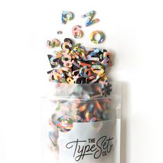 the type set is in a plastic bag with confetti sprinkles