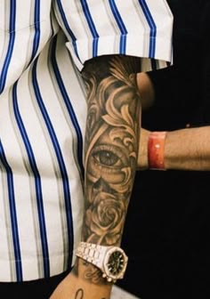 a man with a tattoo on his arm