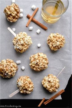 several cookies and marshmallows are arranged on a table