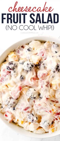 a white bowl filled with fruit salad on top of a table