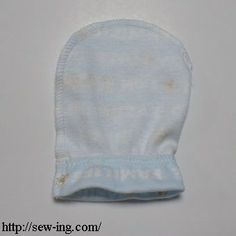 a baby's blue mitt on a white background