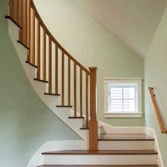 an empty staircase leading up to a window