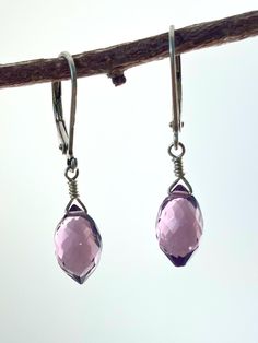 Absolutely gorgeous, rich purple Amethyst makes a quiet statement in these earrings. These are very eye catching! These are a great addition to any collection, and are sure to become favorites. The stones are so sparkly, catching the light. These are truly so pretty on! Photos don't capture them adequately. They are a great Earrings for every day. These simple, delicate beauties hang 1" long on secure sterling silver lever backs. Please see the photo next to a quarter for a size reference. Proud Nickel Free Purple Teardrop Crystal Earrings, Purple Teardrop Crystal Earrings In Sterling Silver, Nickel-free Purple Teardrop Crystal Earrings, Purple Amethyst Teardrop Earrings For Pierced Ears, Purple Teardrop Gemstone Earrings, Purple Amethyst Teardrop Crystal Earrings, Lavender Amethyst Teardrop Earrings, Nickel Free Purple Crystal Drop Earrings, Purple Drop Crystal Earrings Nickel Free