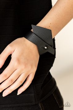 A triangular piece of black leather delicately wraps around the wrist, creating an edgy asymmetrical centerpiece around the wrist. Features a studded button loop closure. Sold as one individual bracelet. Asymmetrical Centerpiece, Live Text, Trendy Fringe, Colorful Frames, Black Order, Pink Peacock, Feather Fan, Jewelry Watch, Black Leather Bracelet