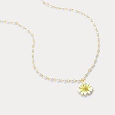 The Daisy Pearl Necklace is a perfect embodiment of elegance and playful charm. Crafted with a radiant enamel daisy pendant, the daisy flower necklace features delicate pearl accents on a gold-plated chain, creating a timeless blend of nature and sophistication. The daisy, with its luminous white petals and golden center, captures the essence of fresh beauty, while the pearls add a touch of classic grace. Ideal for those who adore  nature-inspired jewelry , this piece is both whimsical and versatile, making it perfect for daily wear or special occasions. DETAILS Plating: 18K Gold Materials:   18K Gold on Brass, Enamel, Artificial Pearl, Cubic Zirconia Measurements: Length: 18.50 "(41cm) + Extender: 3.54"(6cm) Pendant   Size : 1.34"*0.67"(1.5cm*1.7cm) Weight: 5.3 g Flower Shaped Pearl Charm Necklace Gift, Flower Shaped Pearl Charm Necklace As Gift, Flower Shaped Pearl Charm Necklace For Gift, Dainty Flower Shaped Pearl Charm Jewelry, Spring White Pearl Charm Jewelry, Dainty Flower-shaped Jewelry With Pearl Chain, Gold Daisy-shaped Jewelry For Summer, Gold-plated Flower Pendant With Pearl, Daisy Pearl Necklace