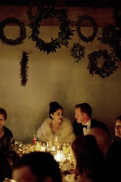 a group of people sitting around a dinner table